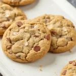 Homemade Chick-fil-A cookies with milk chocolate and white chocolate chunks, freshly baked and placed on a white tray.