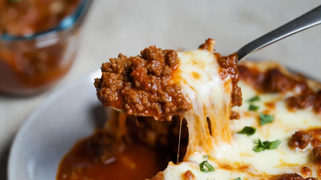 cheesy Chicago deep dish skillet spoonful with ground beef”
