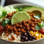 taco ground beef bowl with rice, beans, corn, avocado